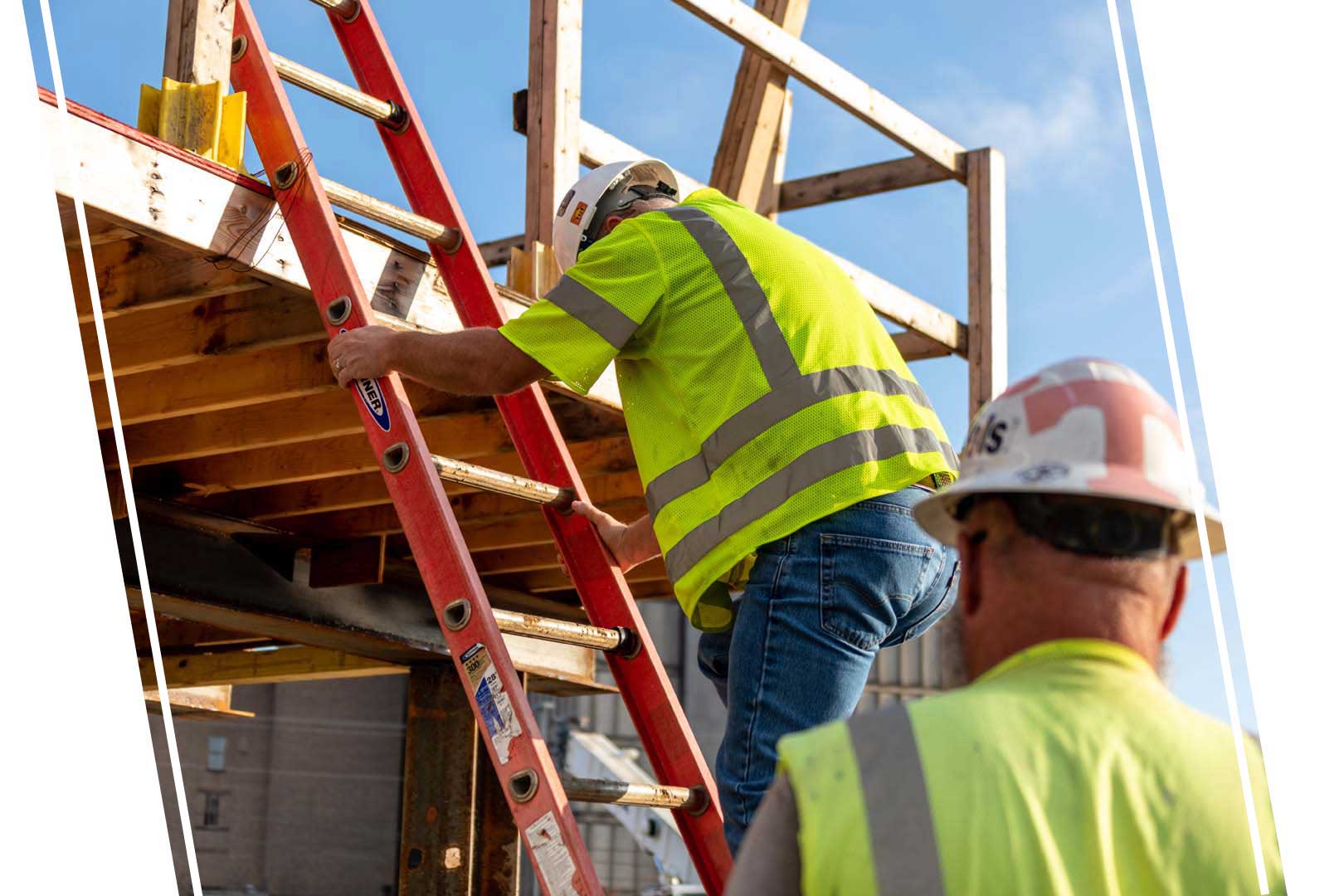 Construction worker going up a ladder